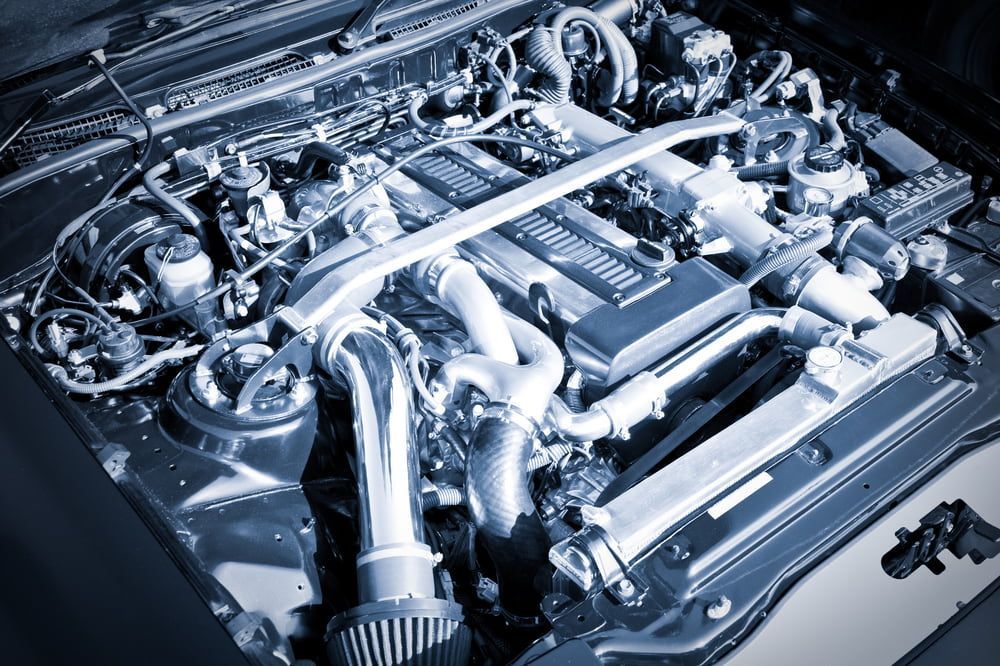 A Close Up Of A Car Engine With The Hood Open — MJ's Mobile Car Mechanic In Bulli, NSW