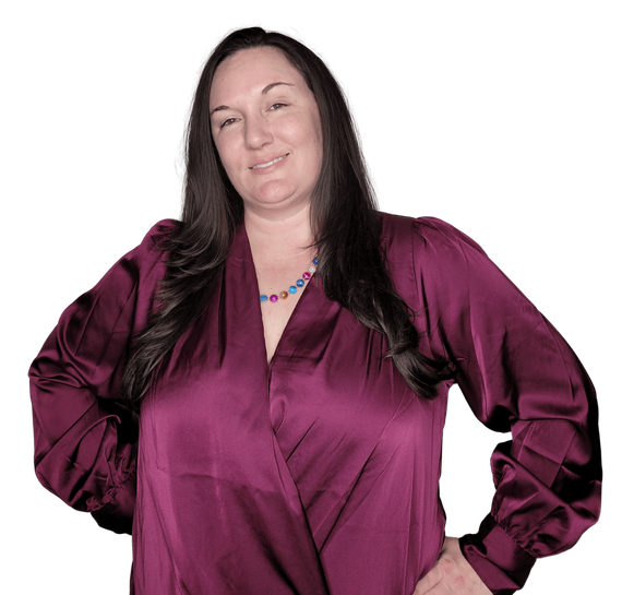 Woman in burgundy satin shirt, hands on hips, smiling, against a white background is Christina Binns, Realtor.