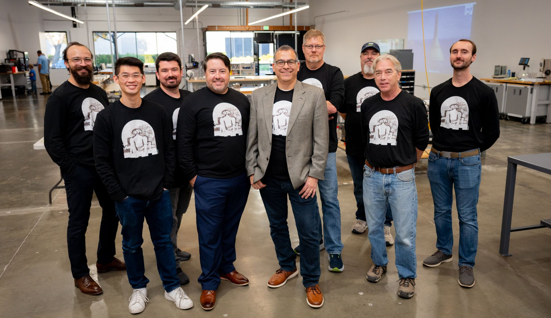 Group photo of advanced development team in matching uniform shirts
