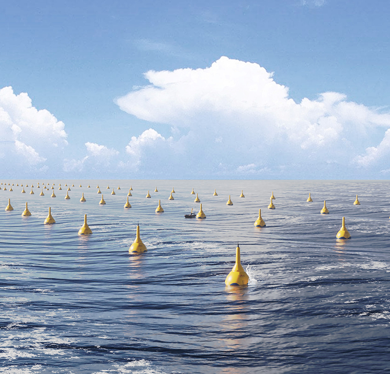 A landscape of ocean surface with hundreds of large yellow floating buoys
