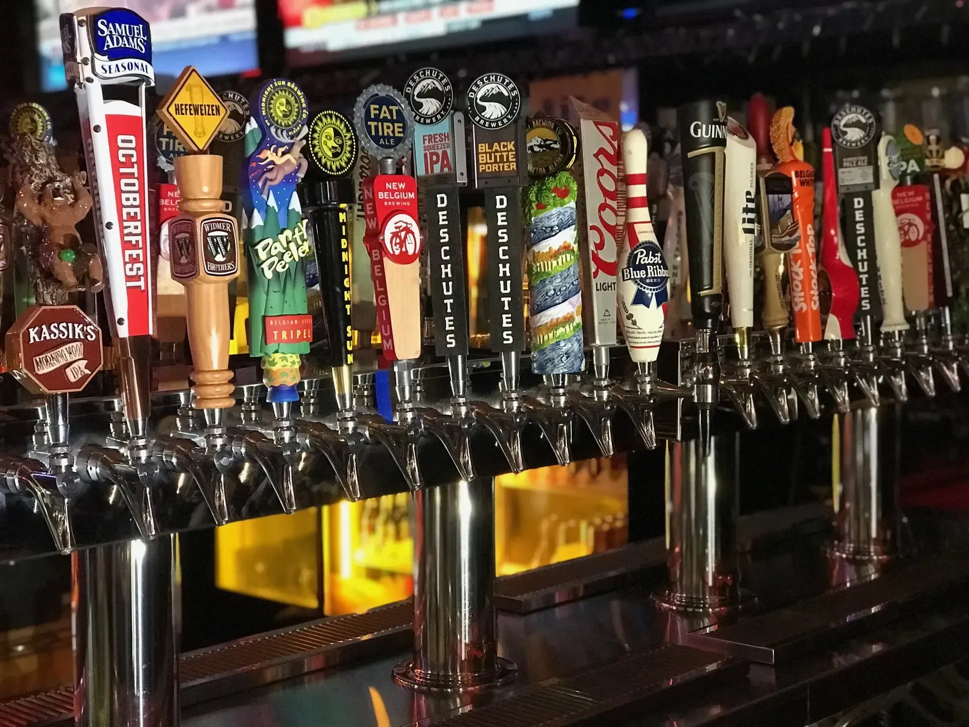 A bar with a lot of beer taps on it