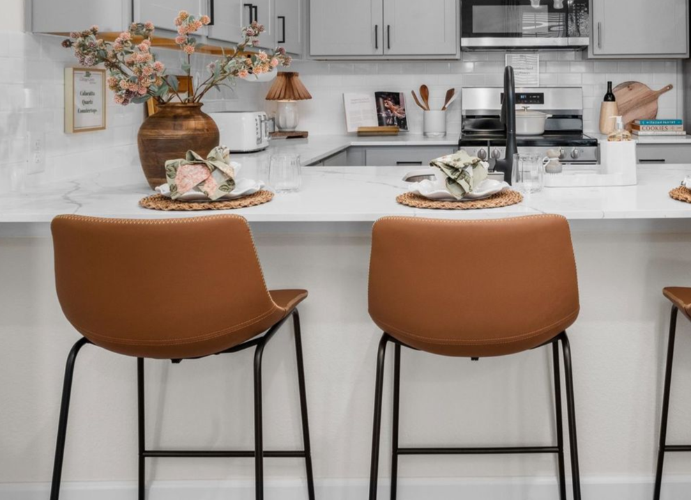 Open-concept kitchen with breakfast bar at The Cottage Green Baytown apartments for rent