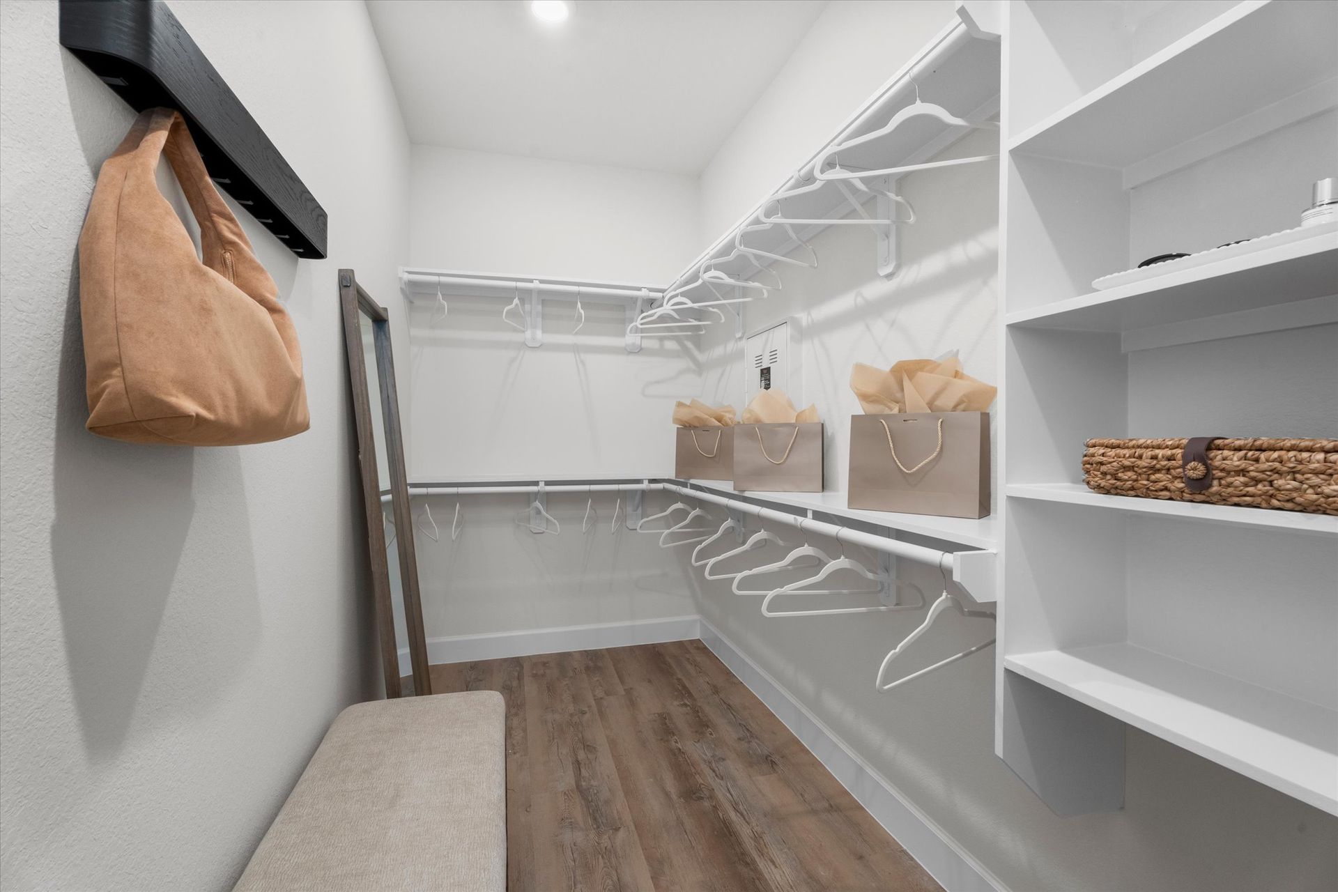 Spacious walk-in closet in an apartment home at The Cottage Green Baytown in Baytown TX