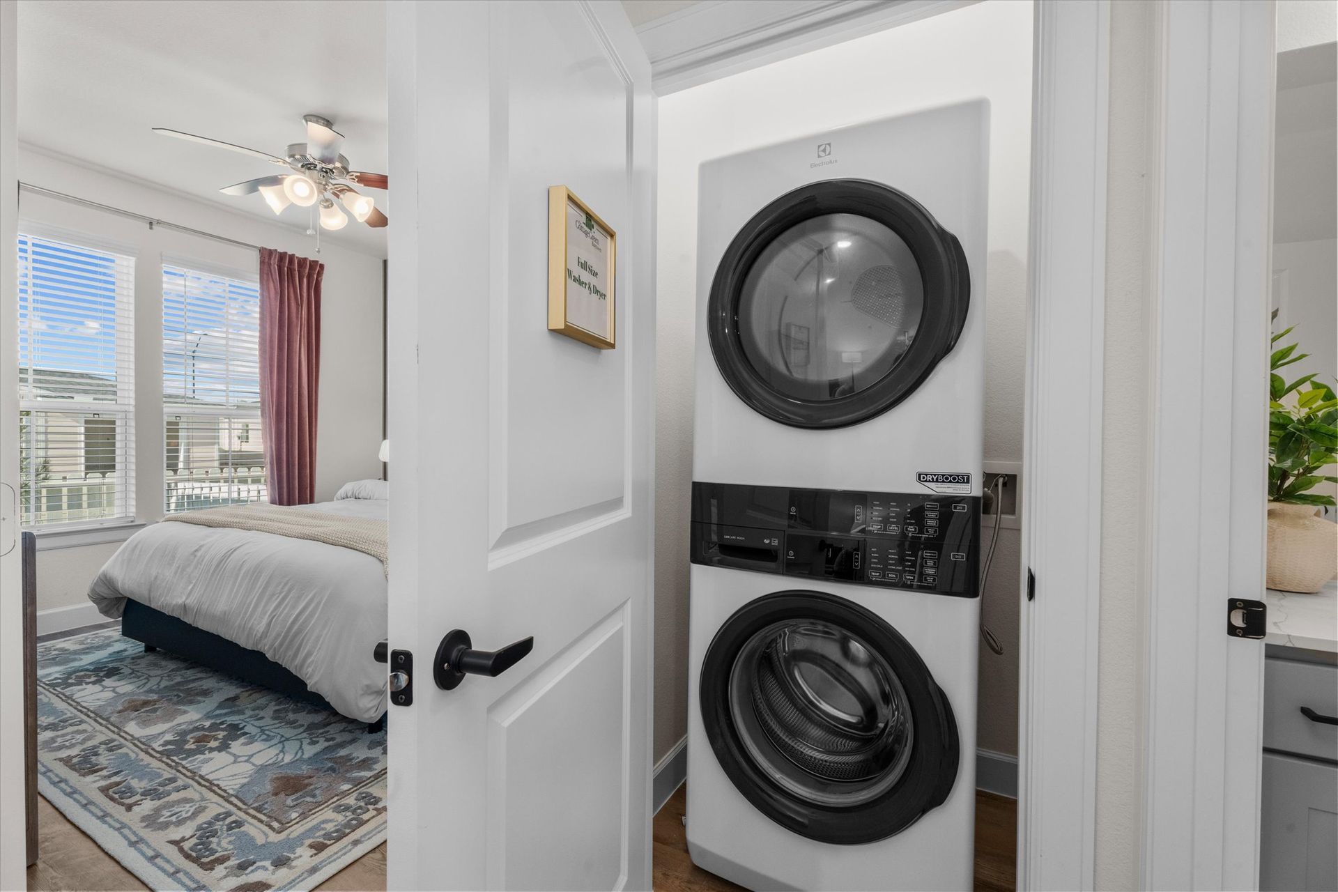 In-home washer and dryer in an apartment at The Cottage Green Baytown in Baytown TX