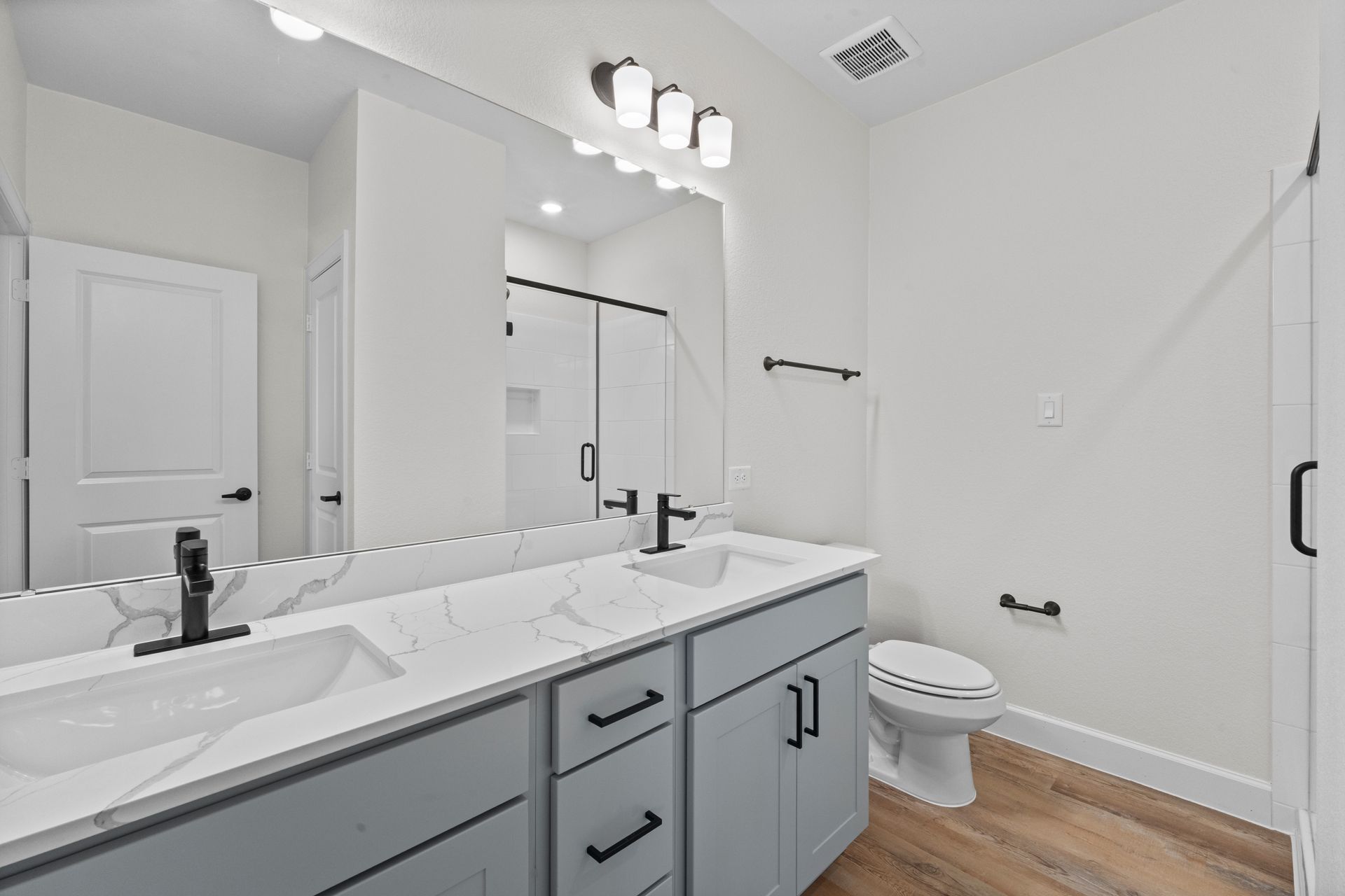 B4 two bedroom apartment kitchen with island at The Cottage Green Baytown in Baytown TX