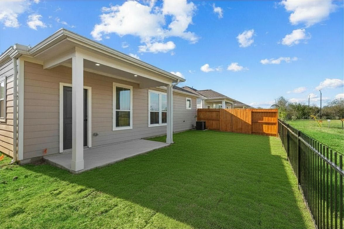Cottage-style apartment home with private fenced yard at The Cottage Green Baytown in Baytown TX