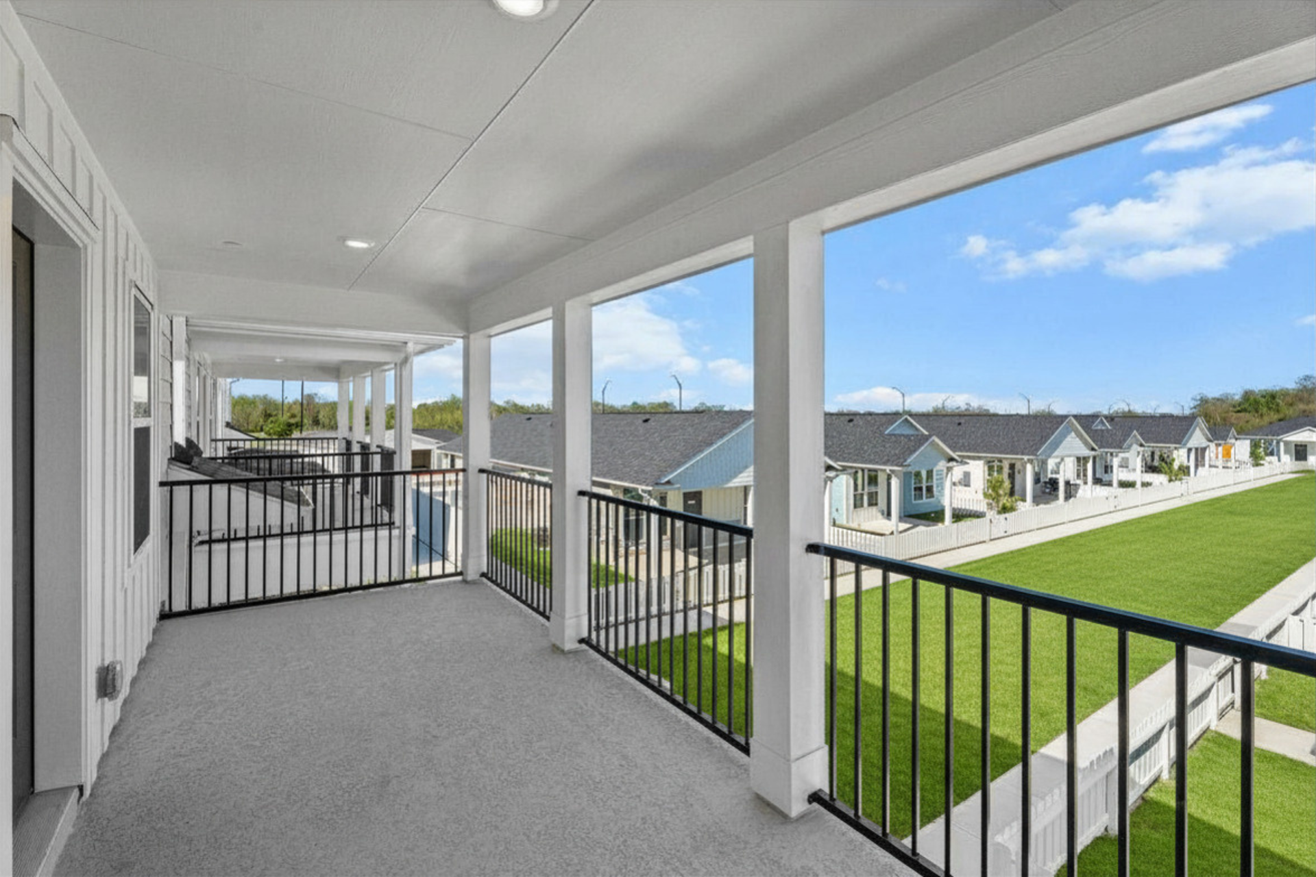 Spacious private balcony overlooking The Cottage Green Baytown apartment community in Baytown TX