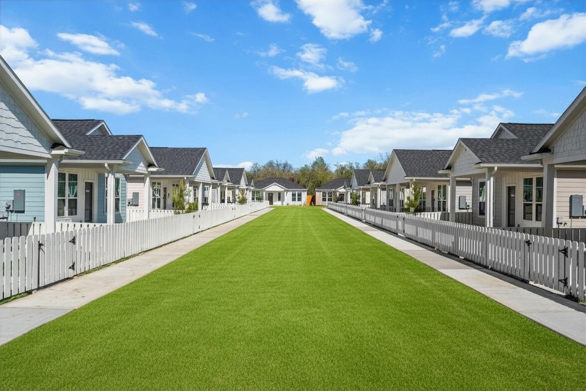 Cottage-style apartment homes with landscaped courtyard at The Cottage Green Baytown in Baytown TX