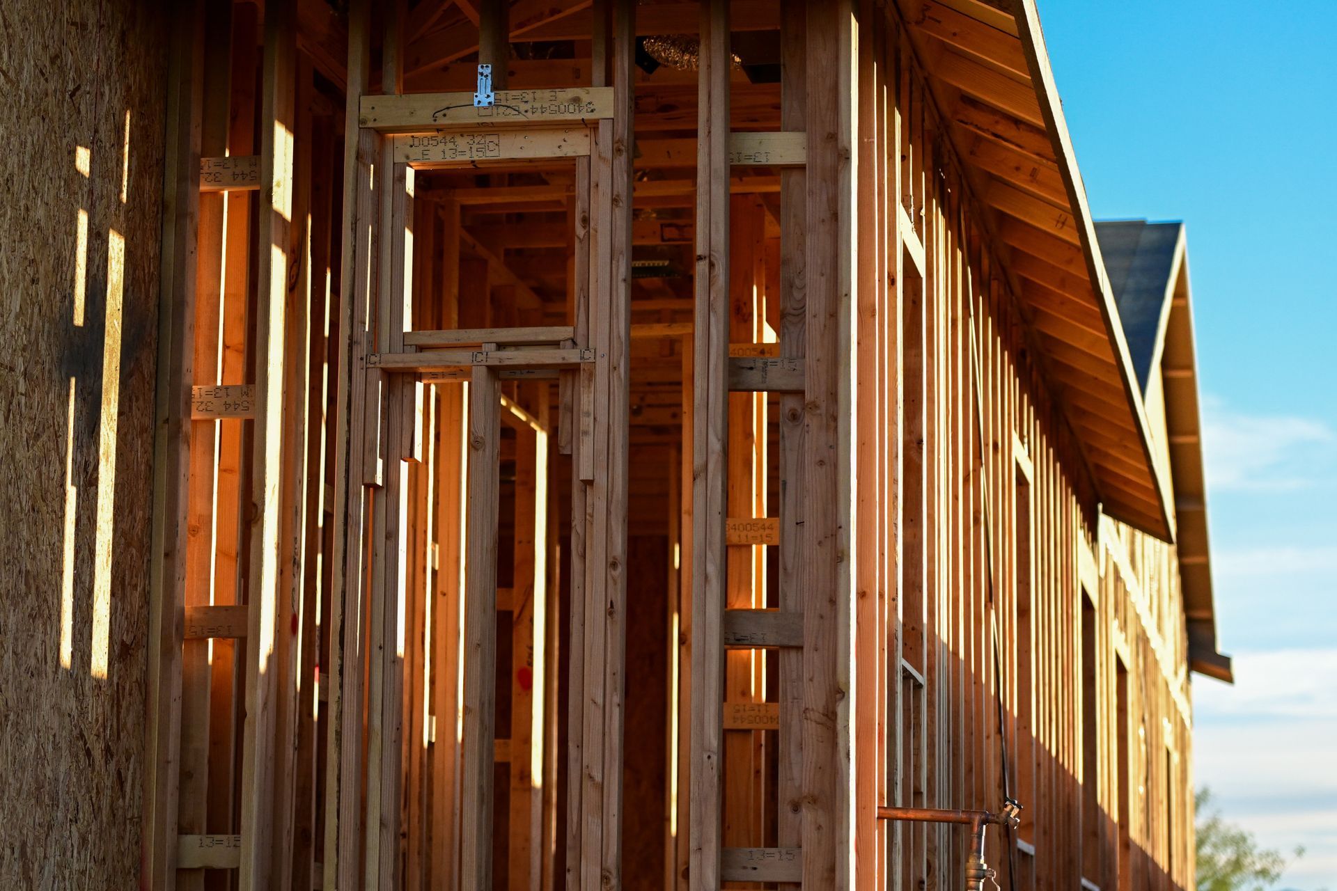 Exterior of a wood-framed residential home under construction.