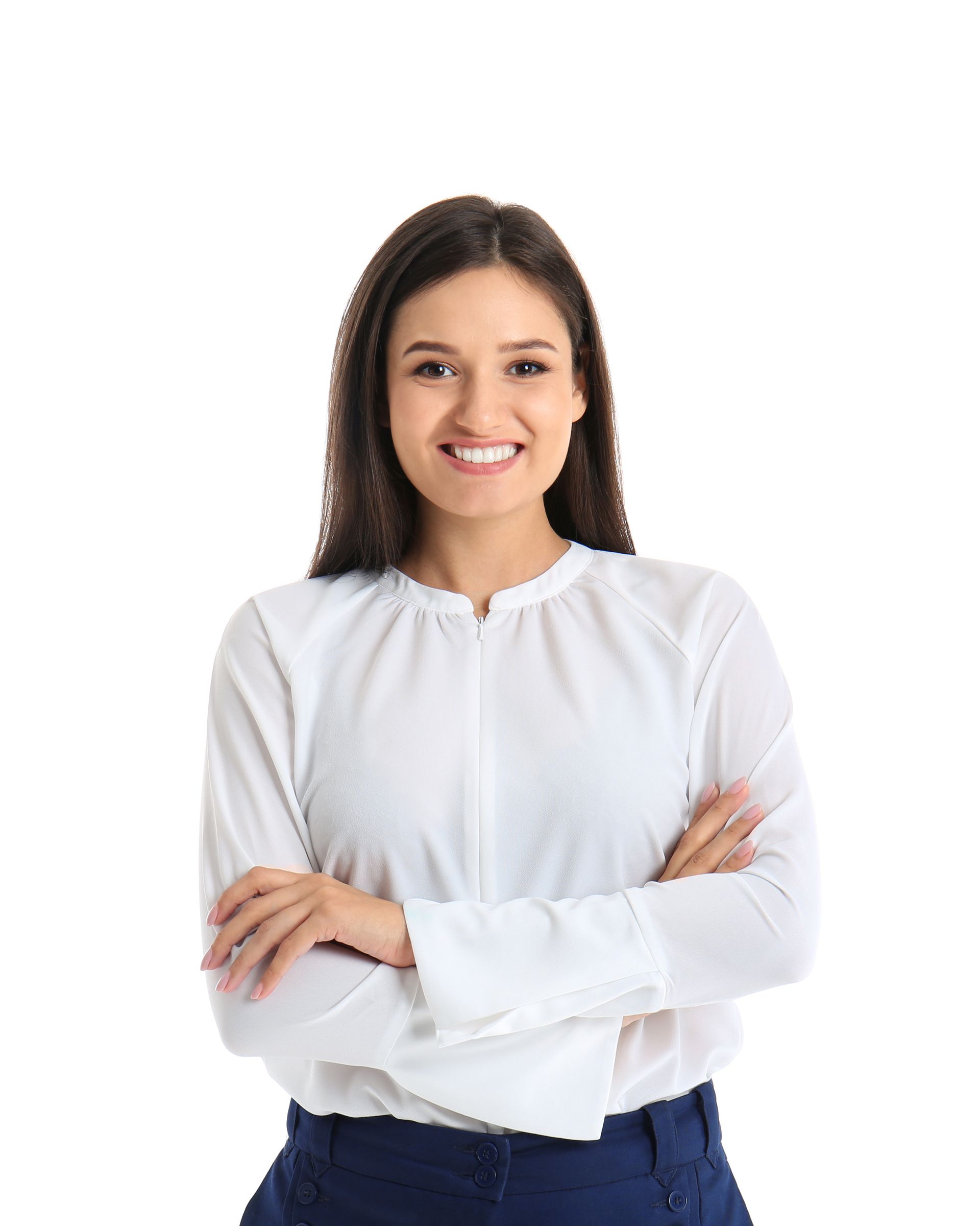 A woman in a white shirt and blue pants is standing with her arms crossed.