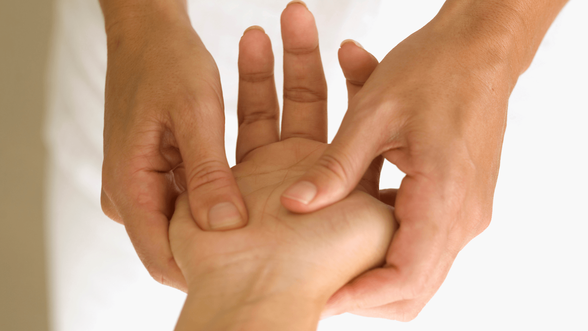 A person is getting a massage on their wrist.