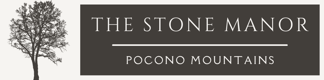 A logo for the stone manor in pocono mountains