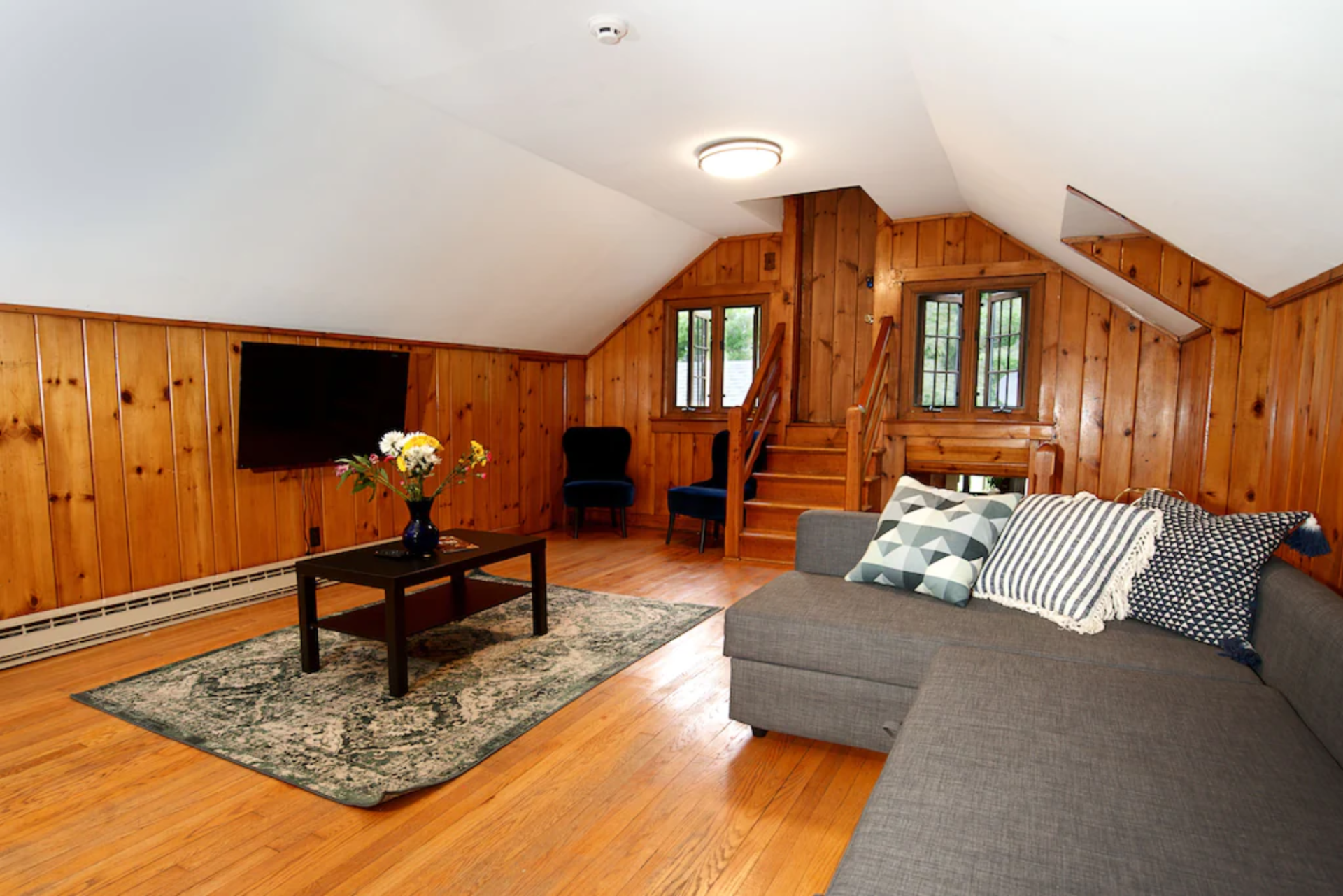 A living room with a couch and a flat screen tv