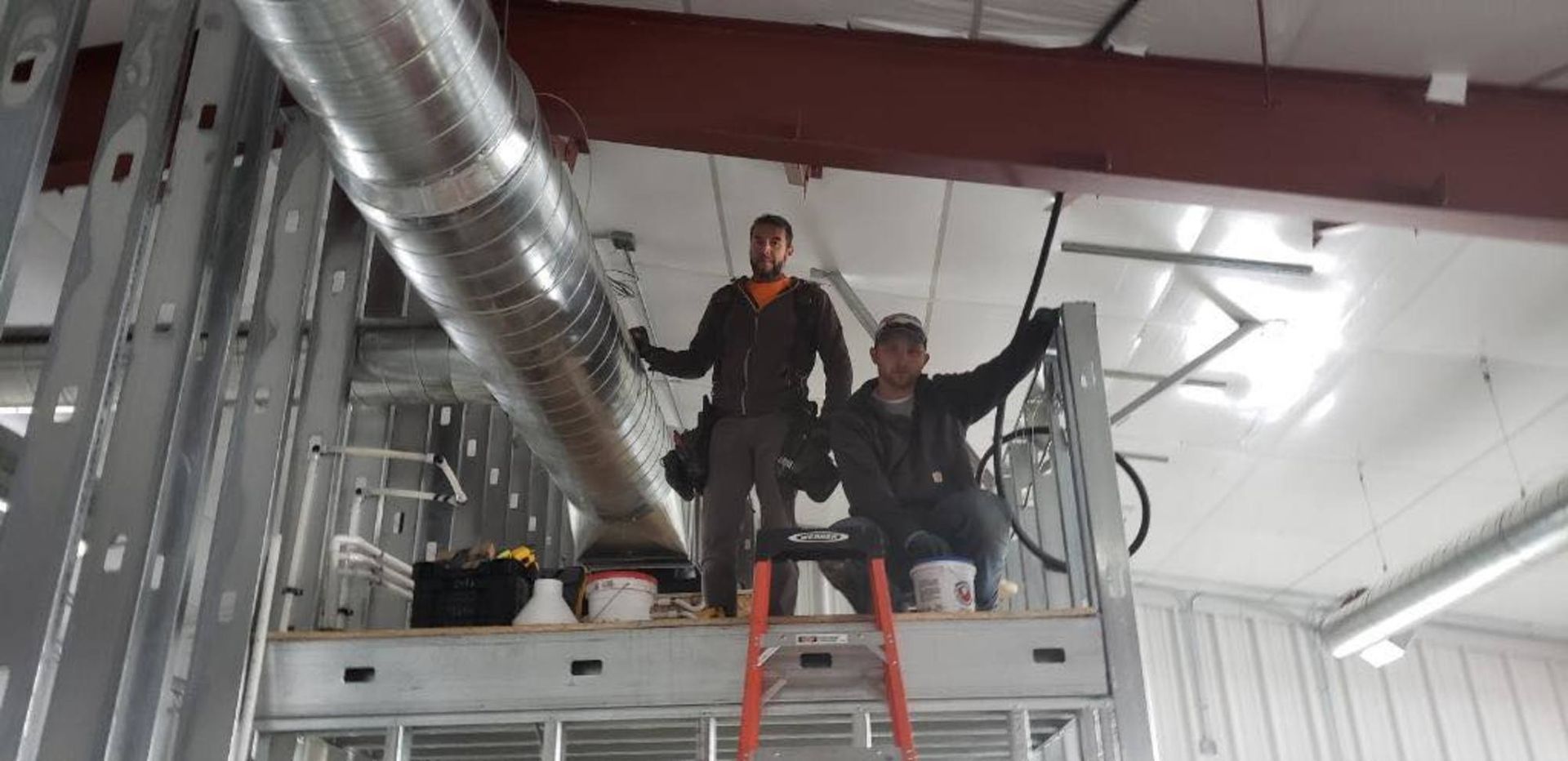 Technician installing HVAC system