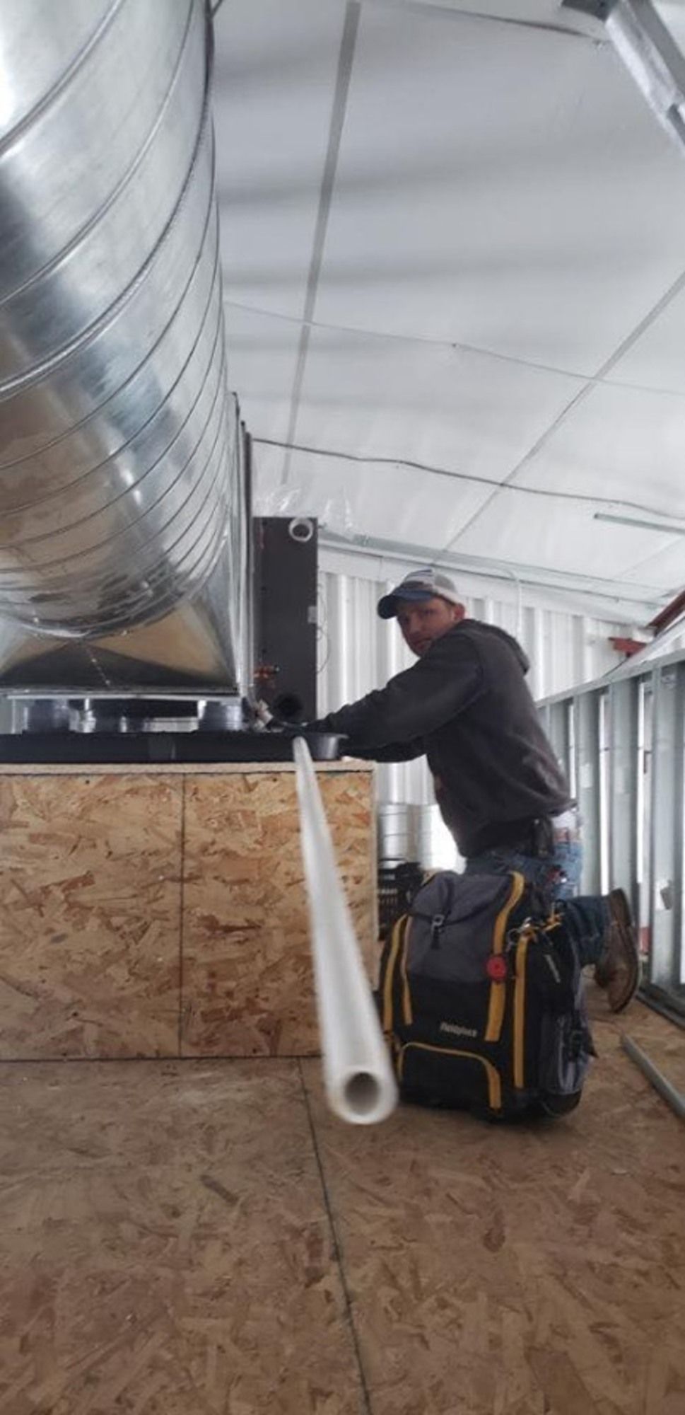 HVAC technician servicing unit
