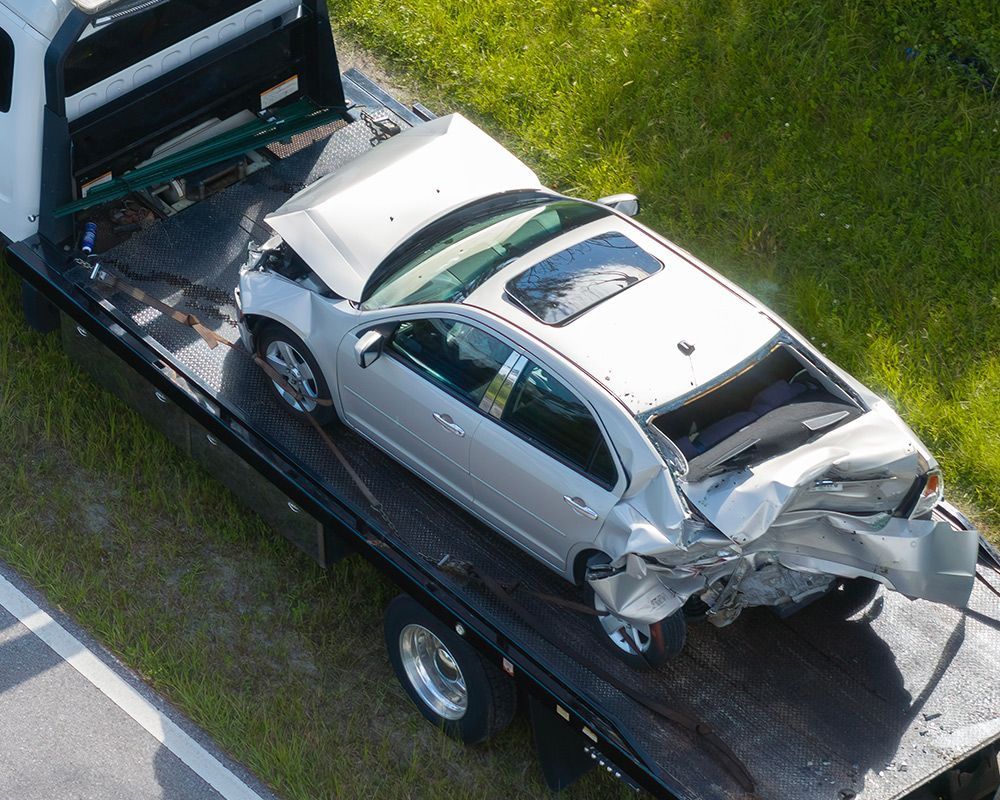 Damage Car on a Tow Truck