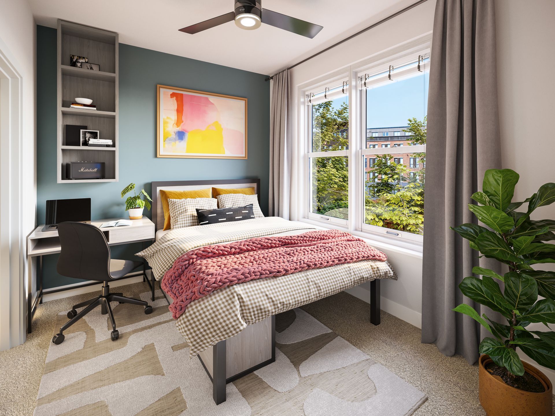 Bedroom with gray bedding, pillows, art, and a floor lamp next to a small wooden table.