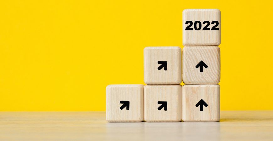 A stack of wooden blocks with the year 2022 written on them.