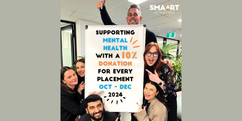 A group of people are holding a sign that says supporting mental health with a 10 % donation for every placement.