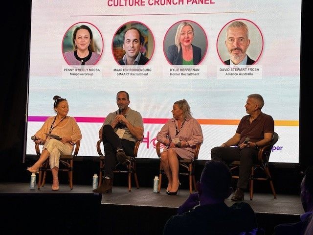 A group of people are sitting in front of a screen that says culture crunch panel