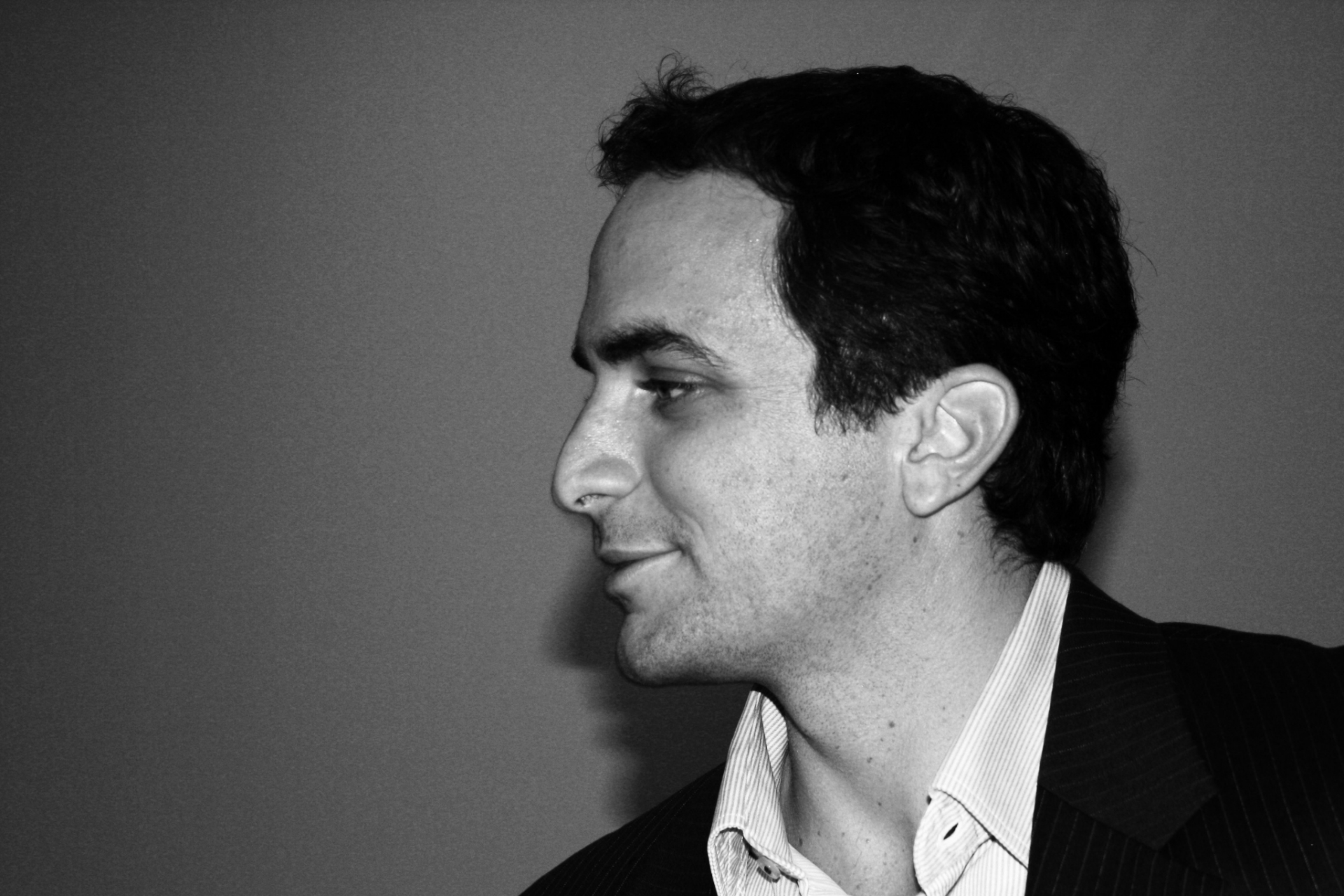 A black and white photo of a man in a suit