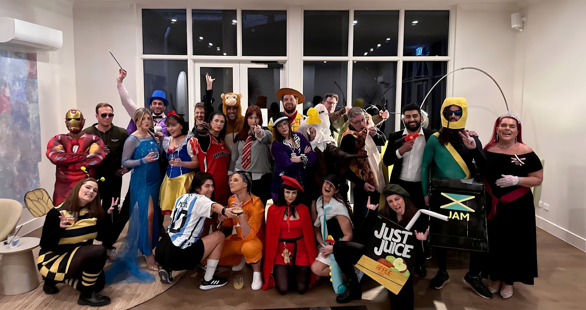 A group of people dressed in costumes are posing for a picture.