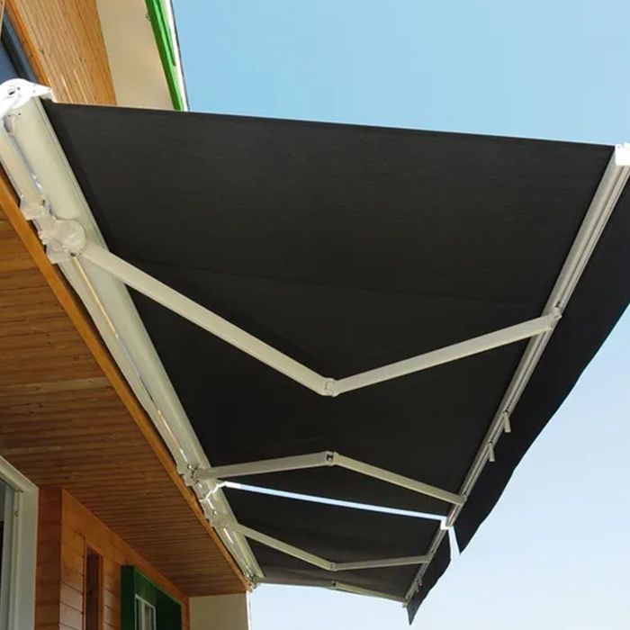 A black and white awning on the side of a building A black and white awning on the side of a building