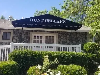 A large building with a blue awning on the side of it