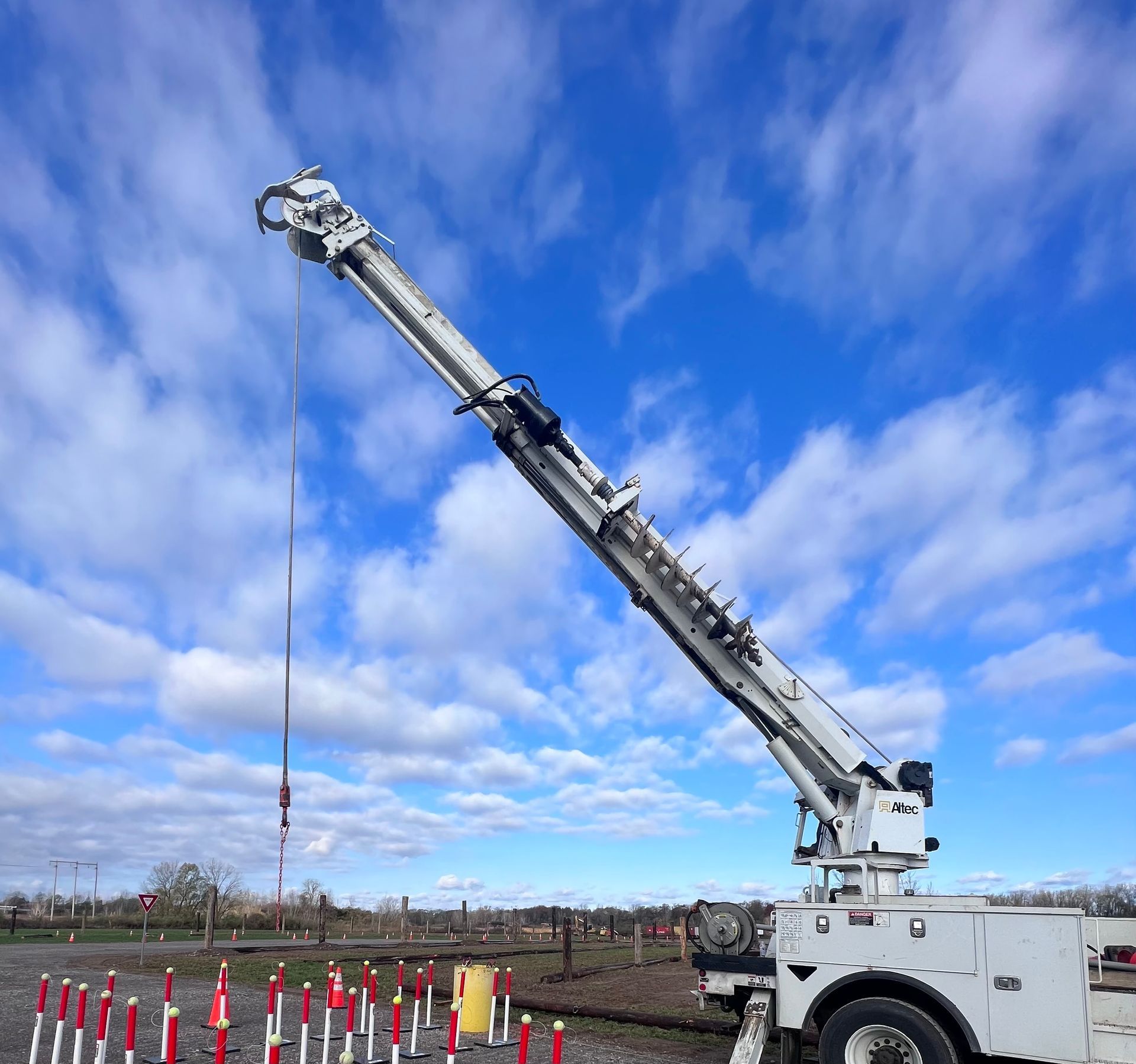 A utility truck with a crane attached to it