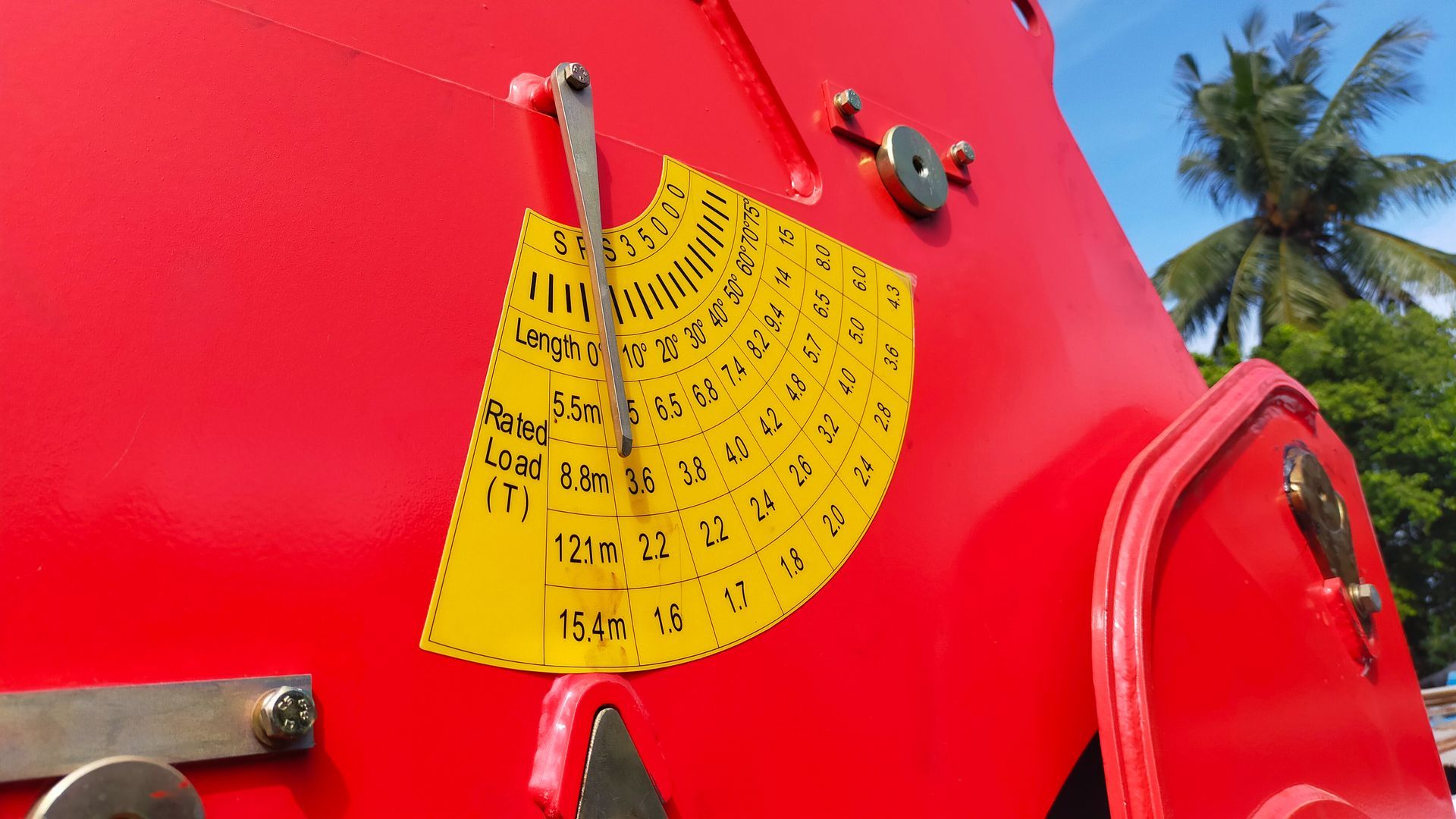 A close up of a red object with a yellow sticker on it.