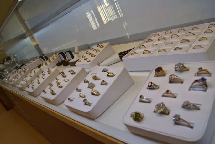 Jewelry loans Covington GA with gold rings, diamond jewelry, and valuable items displayed for collat