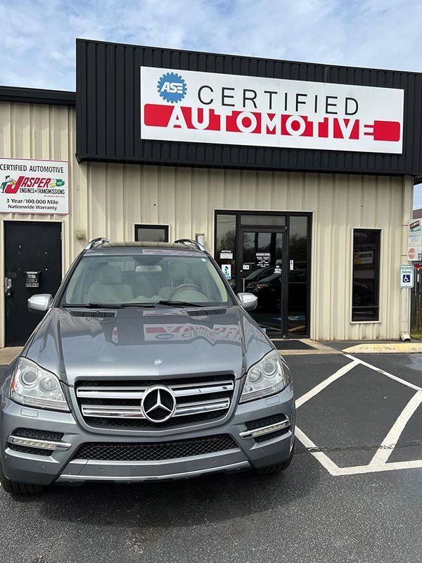 Certified Automotive Facility Exterior With Vehicles | Certified Automotive