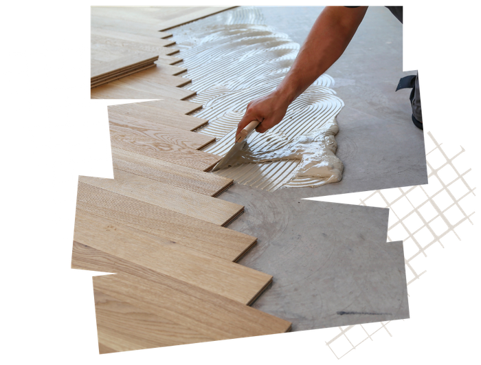 Person applying adhesive with a trowel to a concrete floor for installing hardwood flooring.