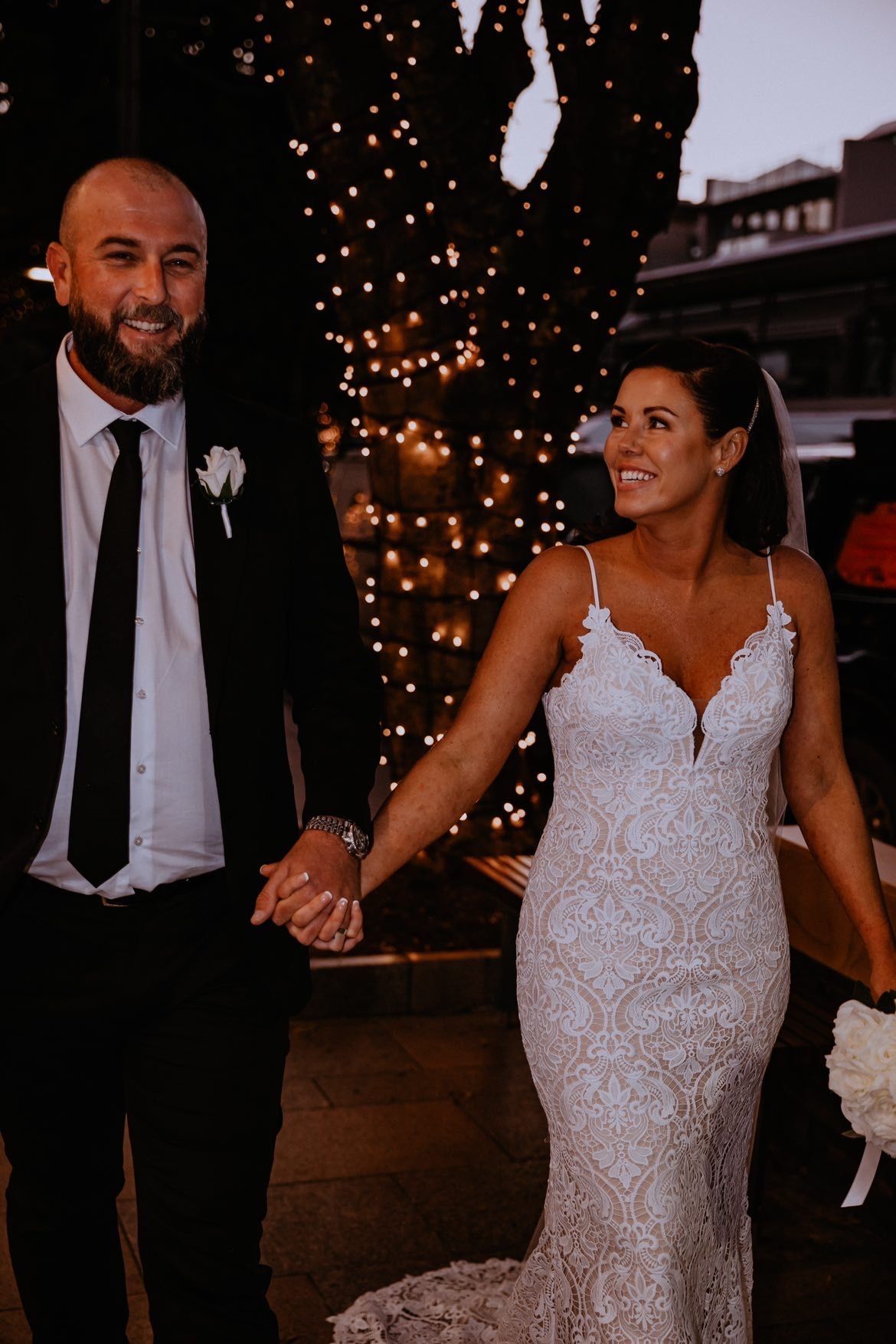 Evening on Hastings street, Noosa with the lights, a couple in love and happy after their Noosa wedding