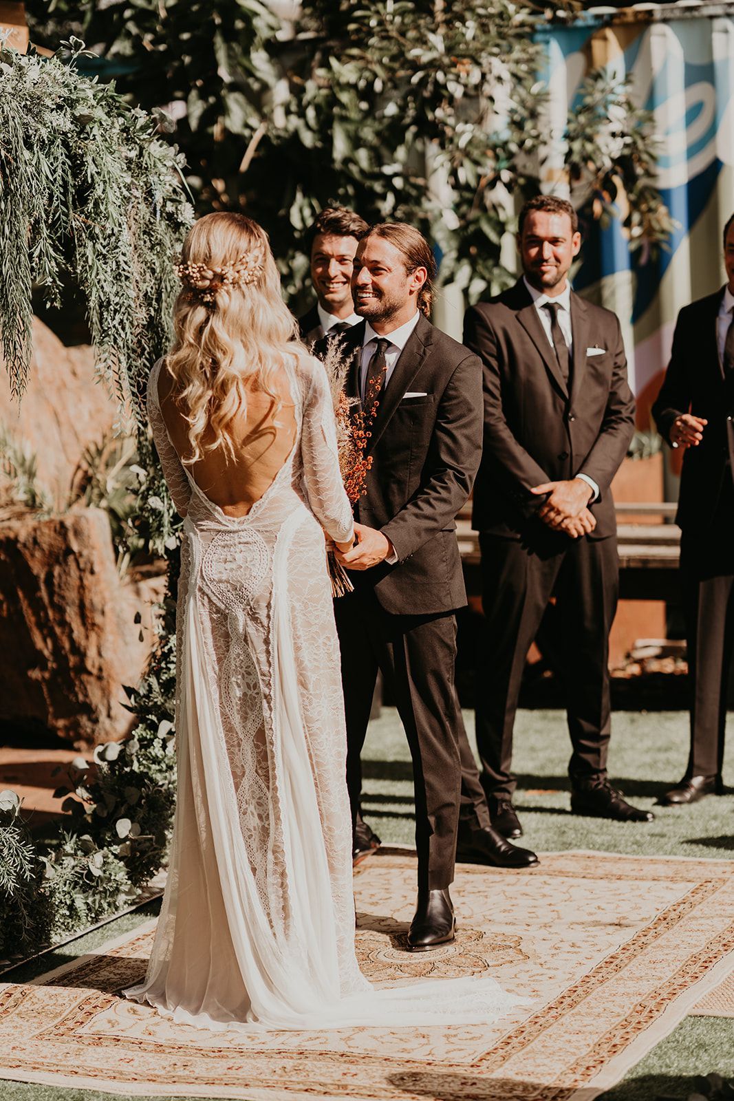 Couple holding hands saying their vows at a wedding in Noosa