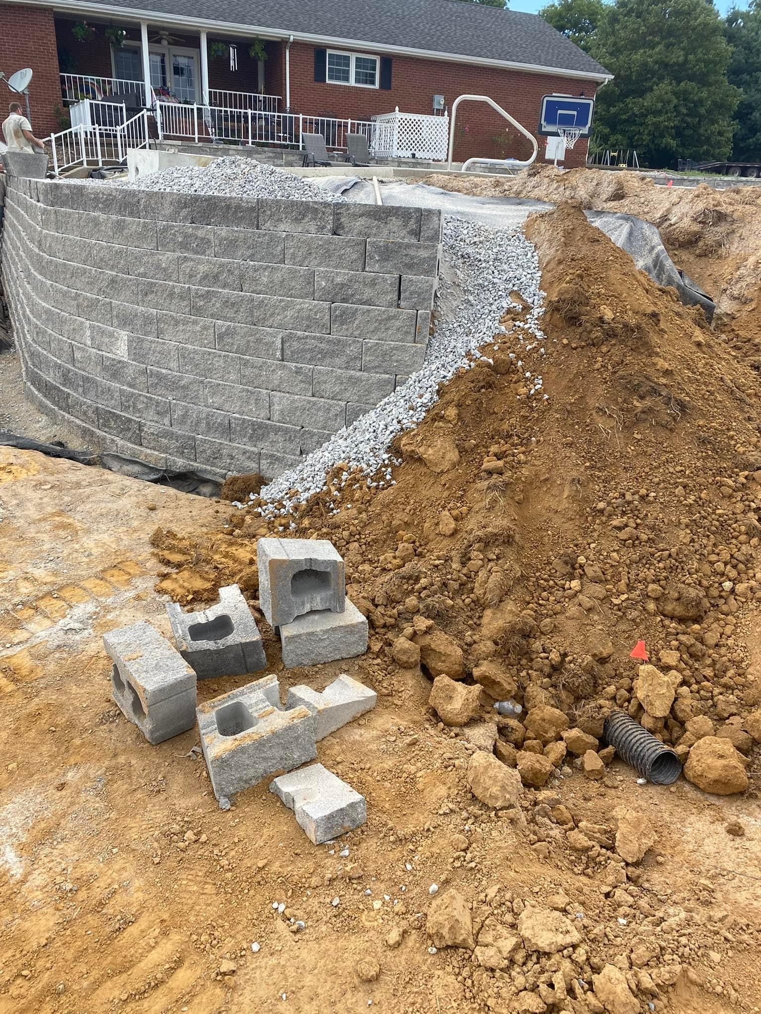 A pile of dirt is sitting in front of a house.