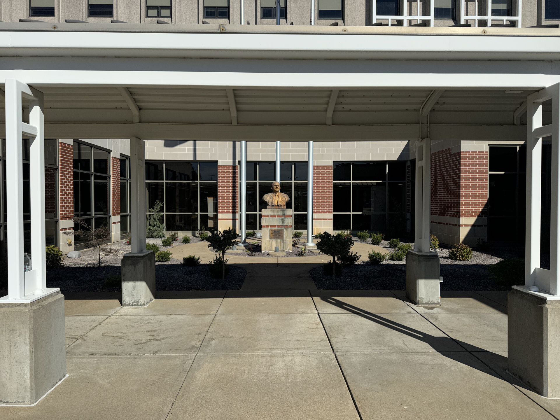 A large building with a statue in front of it