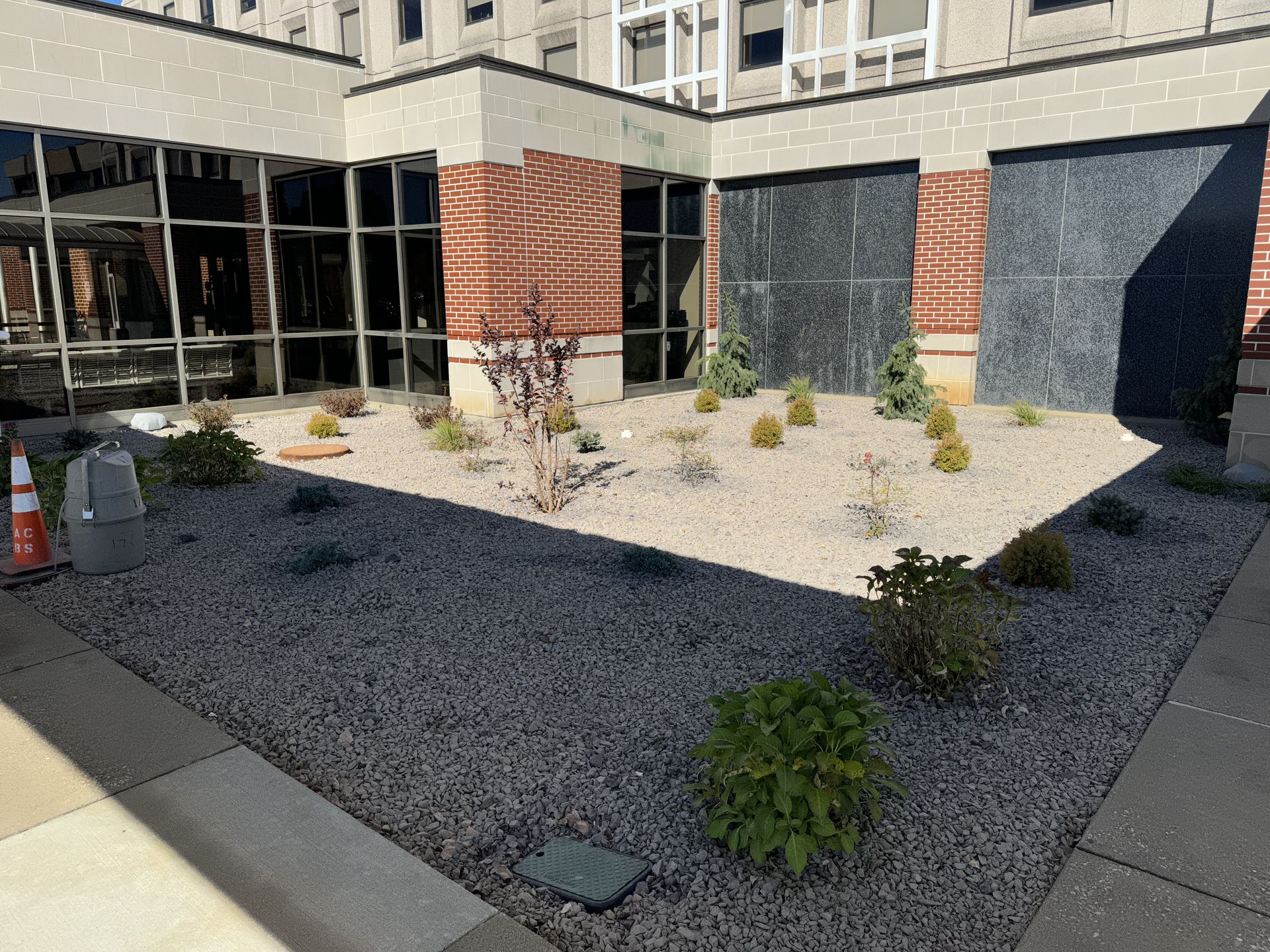 A large building with a garden in front of it.