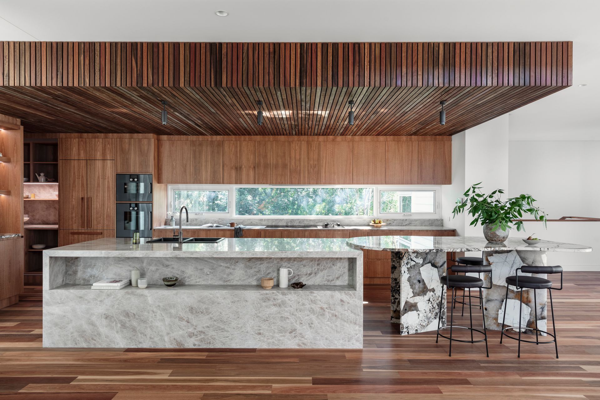 A Kitchen With White Cabinets and Black Tile Floors — Paiano Custom Kitchens In Corrimal, NSW