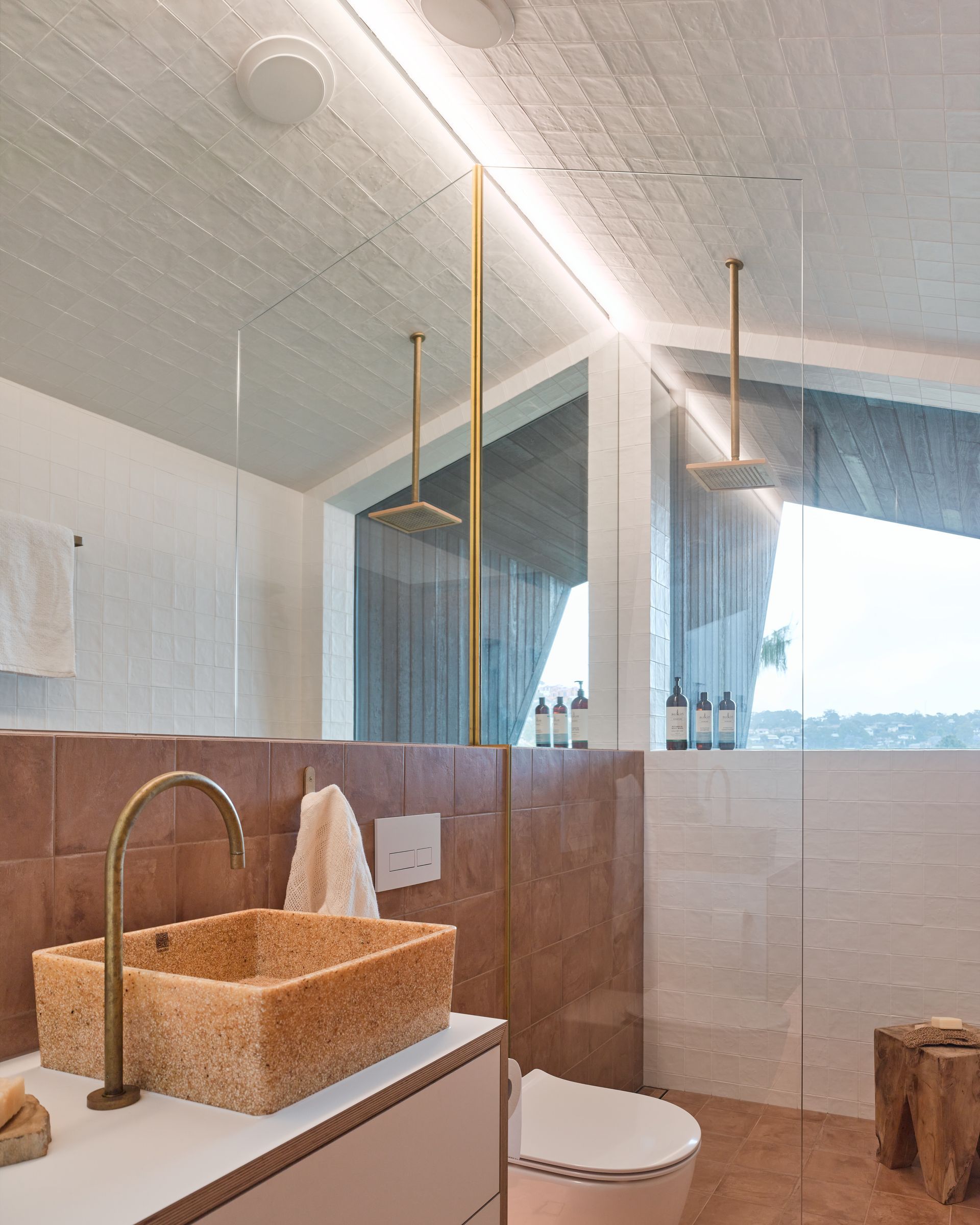 A Modern Bathroom with raised sink, mirror and shower — Paiano Custom Kitchens In Corrimal, NSW