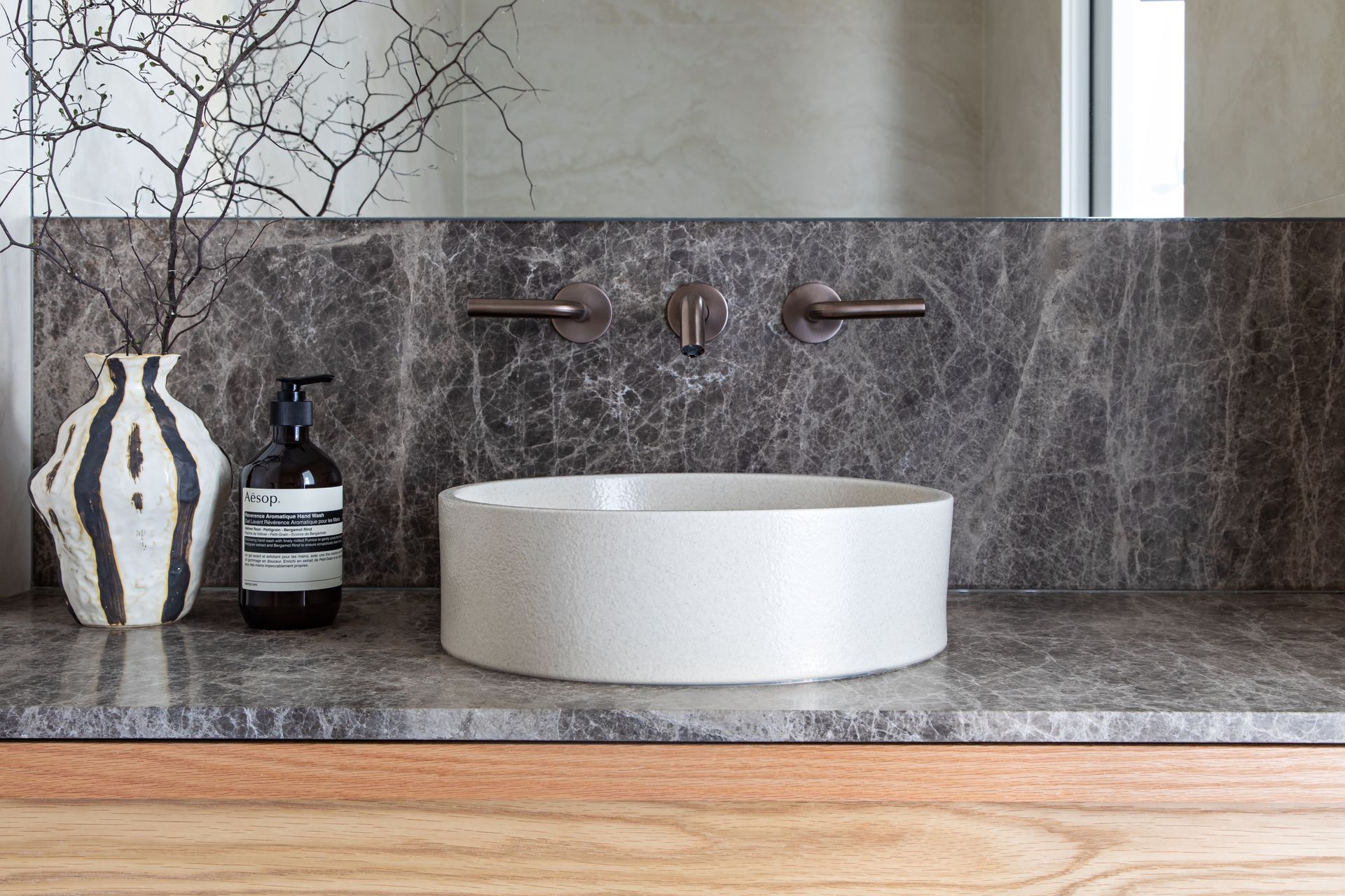 A Bathroom Vanity With Grey Marble And Raised Sink — Paiano Custom Kitchens In Corrimal, NSW