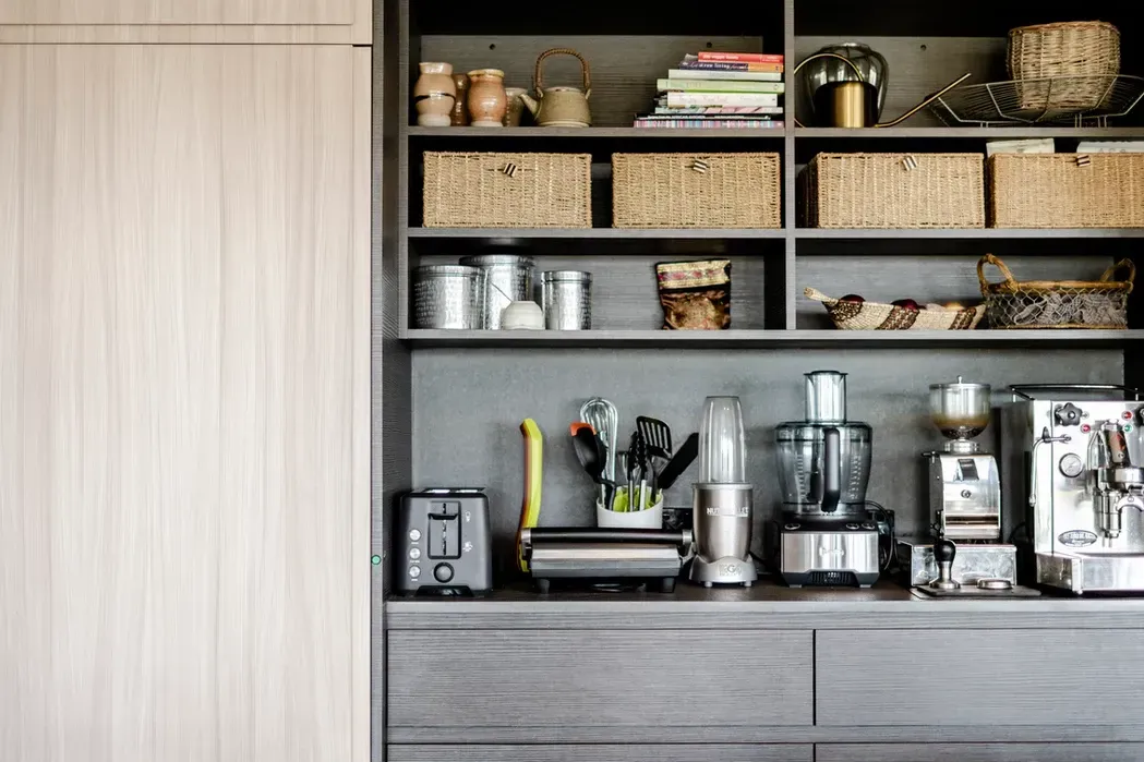A Kitchen With a Lot of Appliances on the Counter and Shelves — Paiano Custom Kitchens In Corrimal, NSW