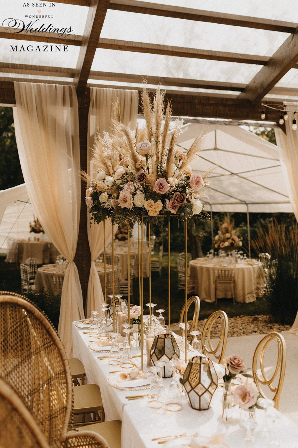 A long table with a vase of flowers on top of it.