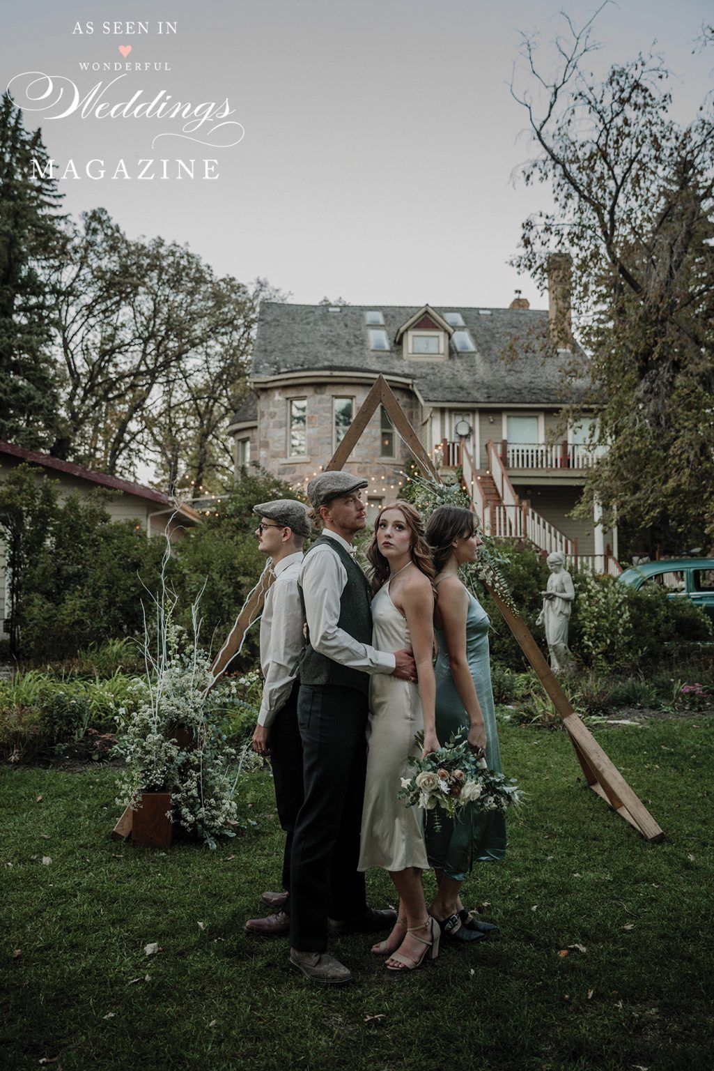 A group of people standing in a grassy field in front of a house.