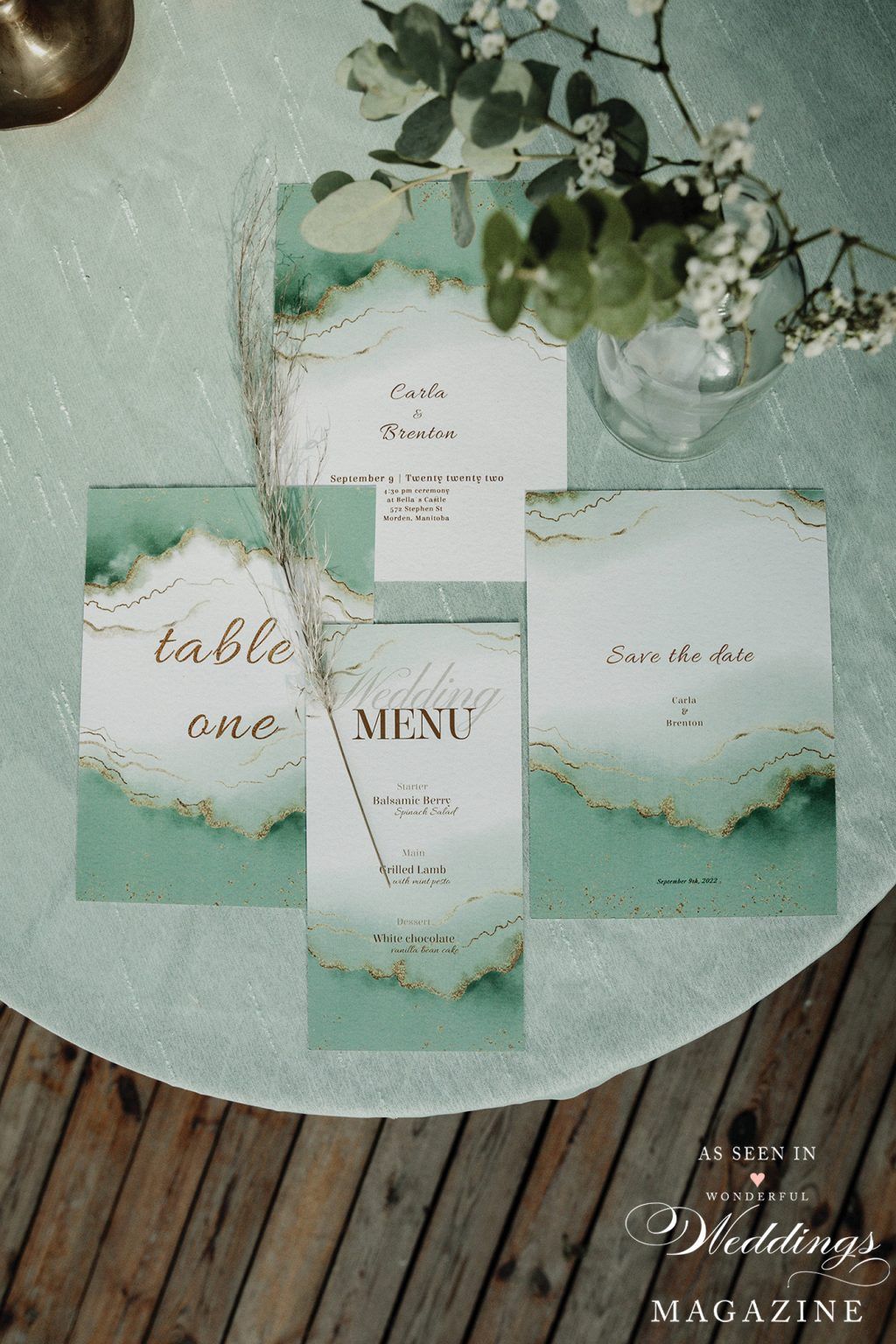 A table with a vase of flowers and cards on it.