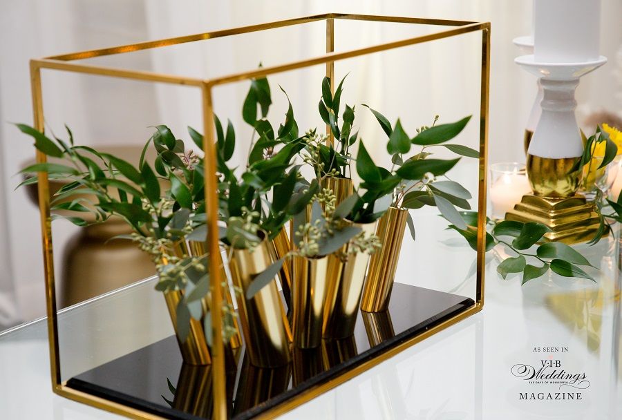 A vase filled with flowers is sitting on a table.