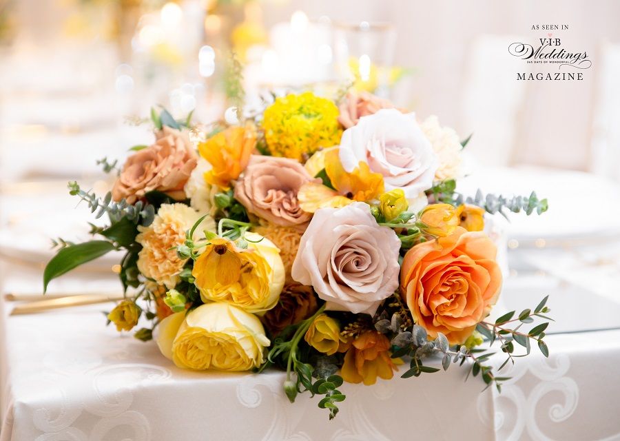 A bouquet of flowers is sitting on a table.