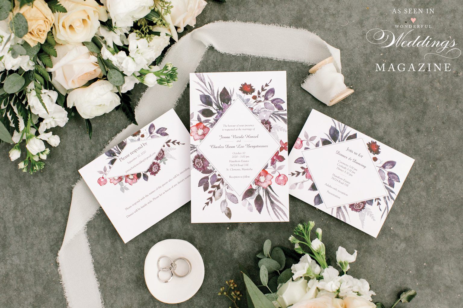 A wedding invitation is sitting on top of a table next to a bouquet of flowers.
