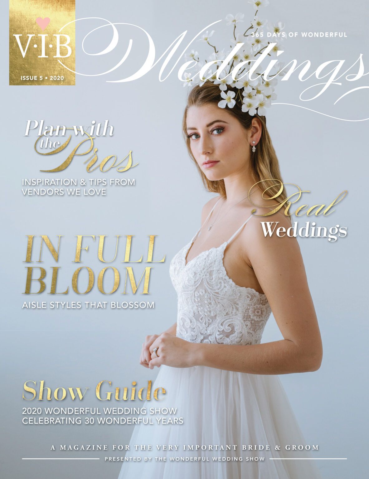 A woman in a wedding dress is on the cover of a wedding magazine.