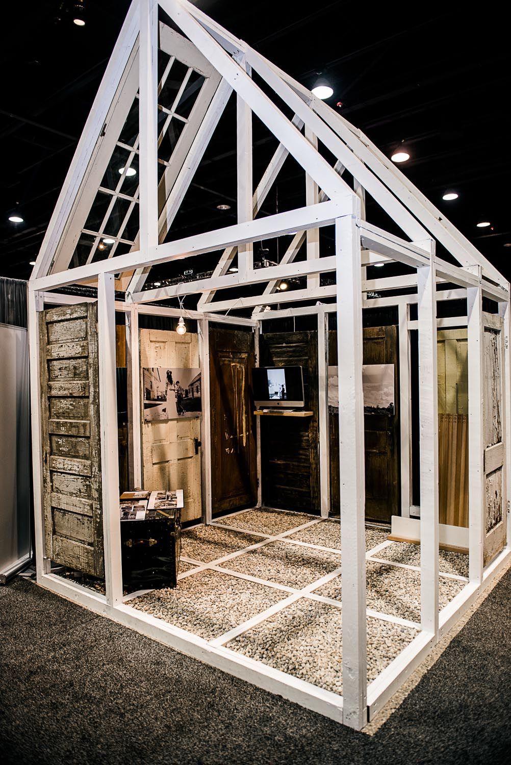A white frame in the shape of a house is being built.